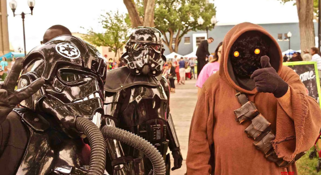 Color photograph of attendees at Roswell's Annual UFO Festival dressed in their favorite SciFi costumes