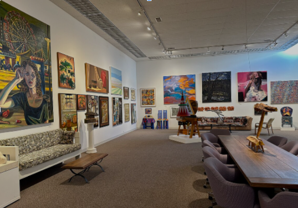 Interior gallery view of Anderson Museum showing colorful abstract paintings and sculptures by local artists in Roswell