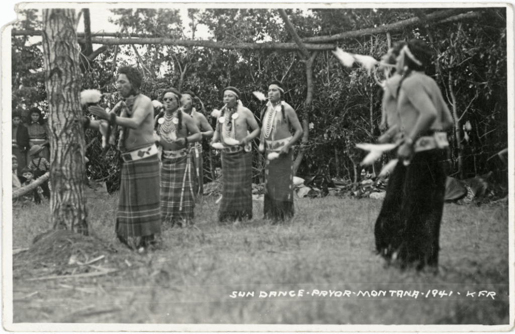 Black and white photo of a Crow Sun Dance from 1941. 
