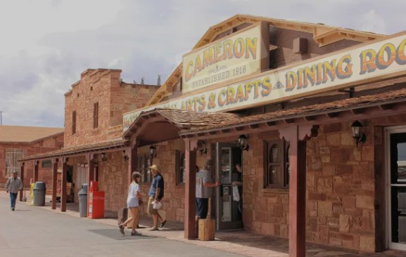 Historic Cameron Trading Post stone building with Arts & Crafts and Dining Room signs in Arizona