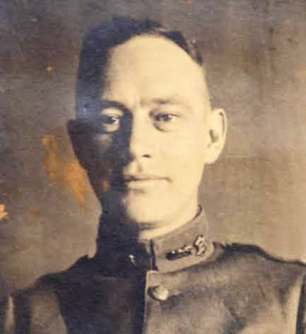 Old black and white photo of Conrad Hilton as a young soldier the founder of the hotel chain