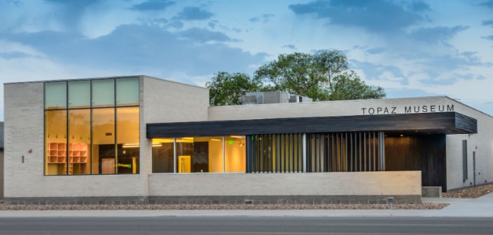 Exterior of the Topaz Museum building on Main Street in Delta, Utah at dusk