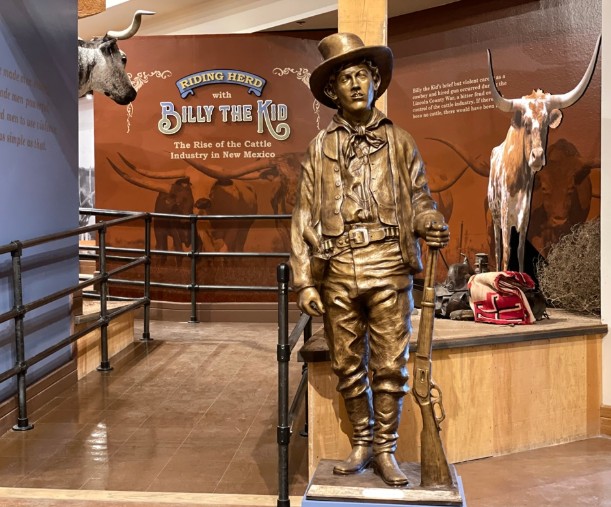 Bronze statue of Billy the Kid at the New Mexico Farm and Ranch Heritage Museum, part of the Riding Herd exhibit on the Lincoln County cattle industry