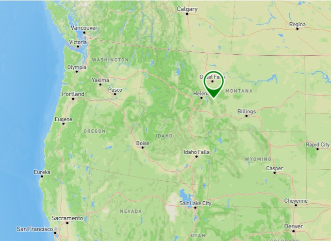 Vintage "Greetings from Great Falls Montana" postcard showing historic landmarks and the Missouri River dams