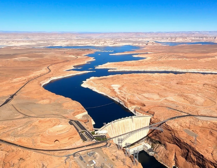 Aerial view of the Glen Canyon Dam with Lake Powell behind it
