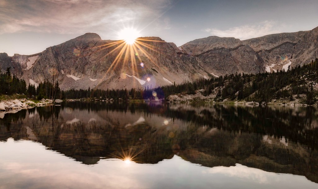 West-looking view of Medicine Bow Peak reflected in a glacial lake just before sunset.