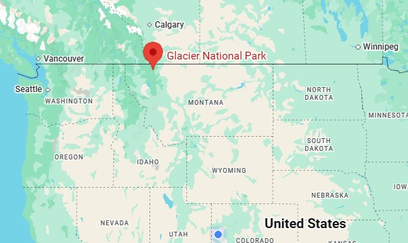 A map of the northwestern United States and western Canada, featuring a red map pin marking the location of Glacier National Park on the northern border of Montana.