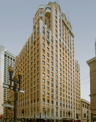 Historical color photograph of the Sir Francis Drake Hotel at San Francisco’s Union Square