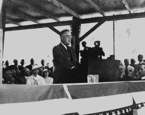 Historical black and white photograph of Franklin D. Roosevelt dedicating the "Boulder Dam" on September 30, 1935.