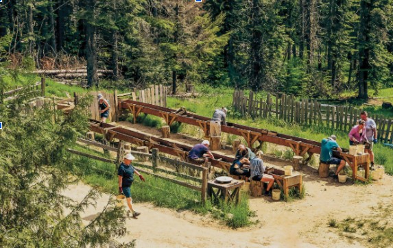 Visitors screening and washing gravel at the Emerald Creek Garnet Area sluice boxes in St. Joe National Forest.