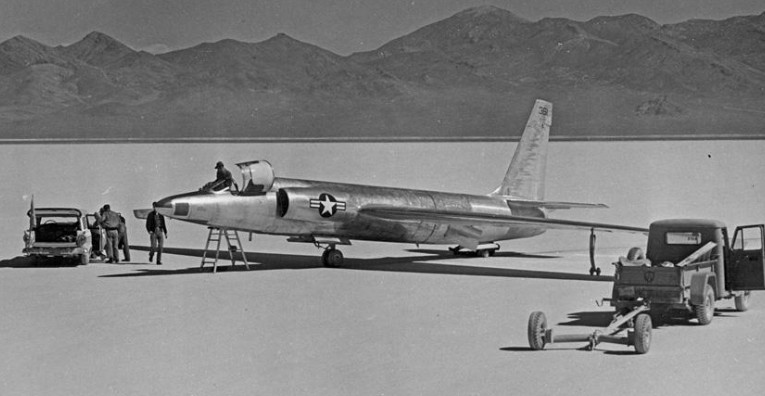 Historic black-and-white photograph of a Lockheed U-2 spy plane on the dry lakebed at Groom Lake, Nevada, during early Area 51 testing.
