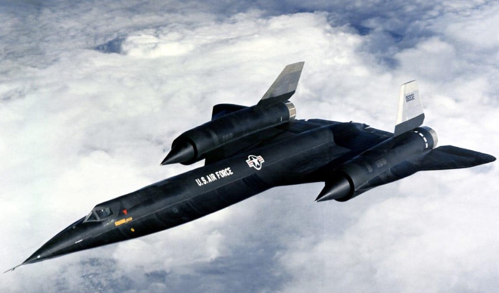 Lockheed A-12 OXCART reconnaissance aircraft flying above clouds during the Cold War, developed for secret testing at Area 51 in Nevada.
